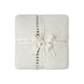 CozyChic Sorrento Stripe Throw in Cream Multi, folded and tied with a ribbon bow