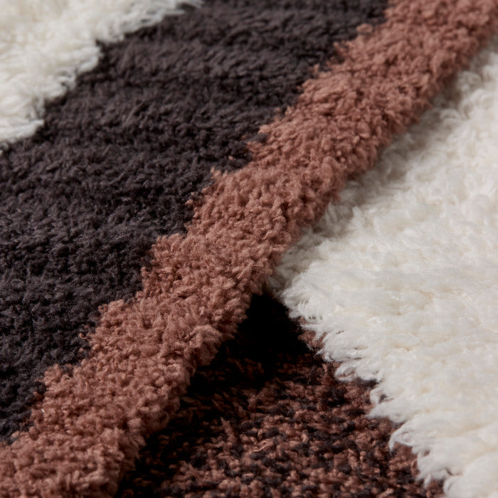 Close-up of the CozyChic Sorrento Stripe Throw fabric in Cream Multi