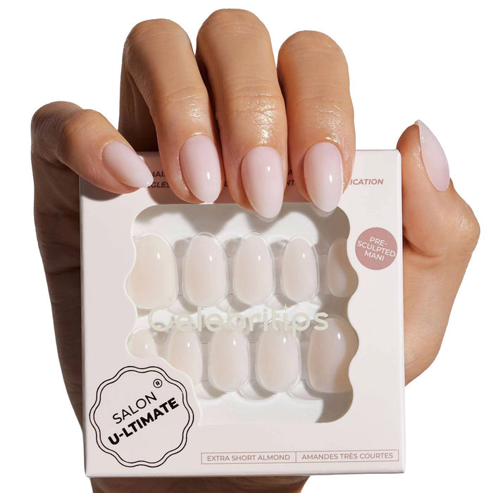 Woman displaying Celebritips press-on nails in Coconut Milk shade with packaging