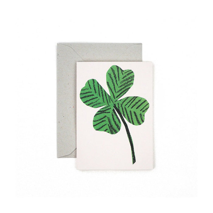 Small greeting card with a clover illustration, paired with an envelope